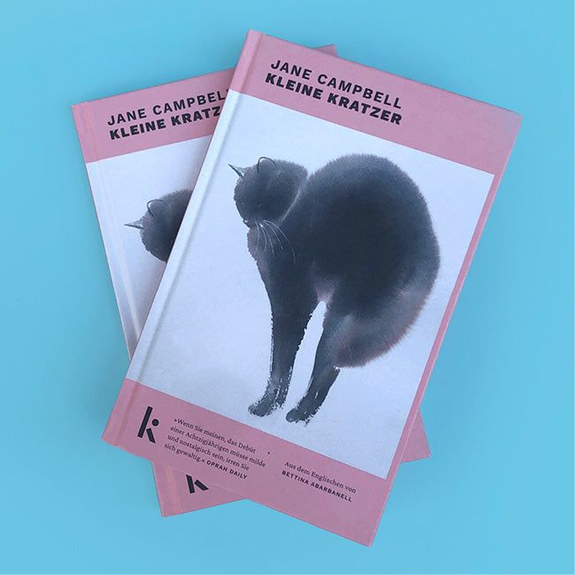 Foto von »Kleine Kratzer«, zwei Bücher übereinander gelegt.